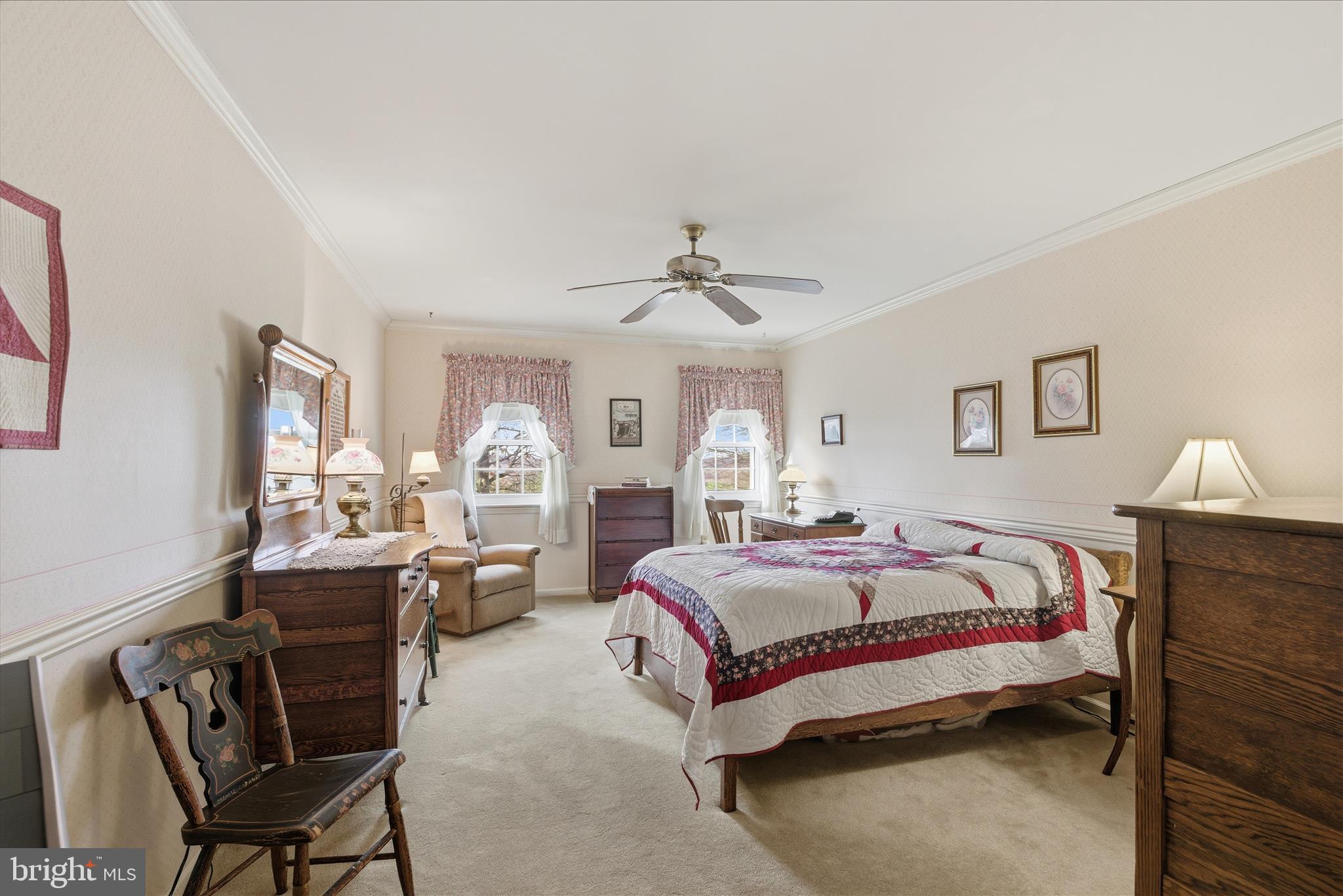 546 Hi View Drive Lititz, PA 17543 - Photo 39 of 65 a spacious bedroom with a bed and a chandelier