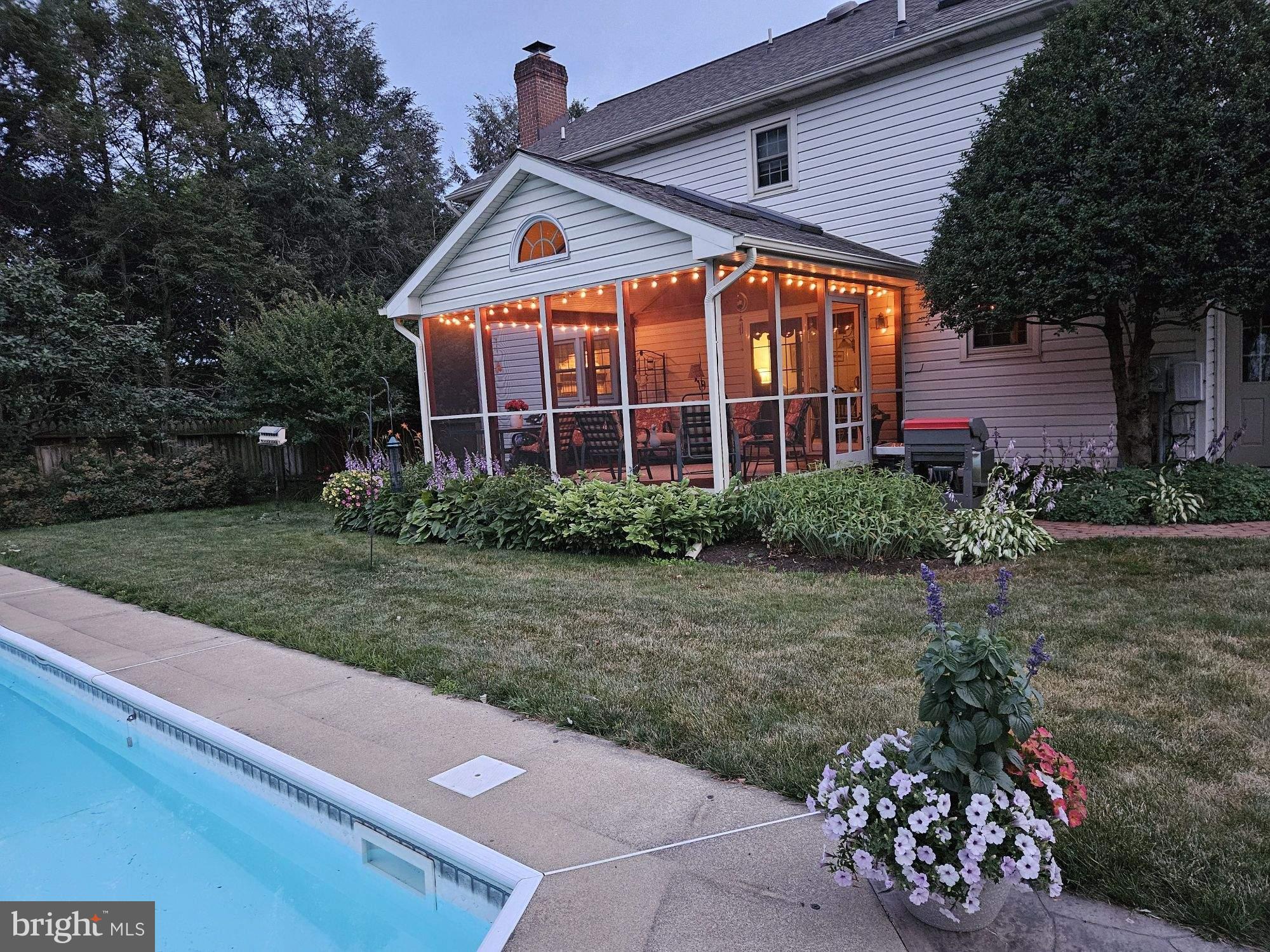 546 Hi View Drive Lititz, PA 17543 - Photo 62 of 65 a front view of a house with a yard and potted plants
