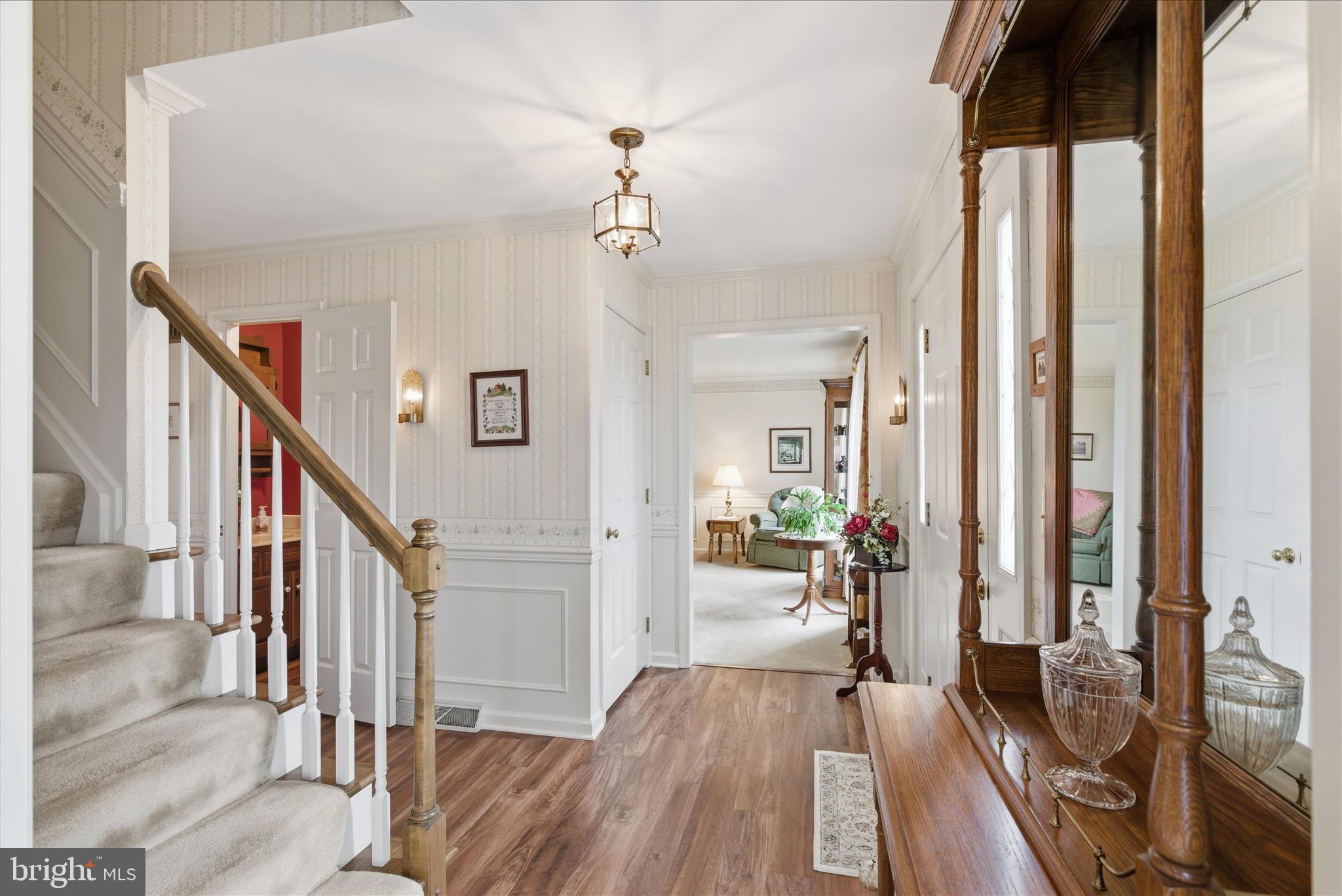 546 Hi View Drive Lititz, PA 17543 - Photo 9 of 65 a view of a hallway with wooden floor and staircase