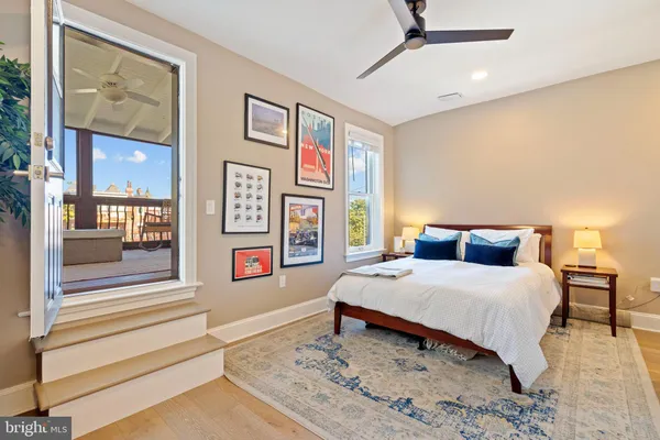 a picture of a wall with a ceiling fan