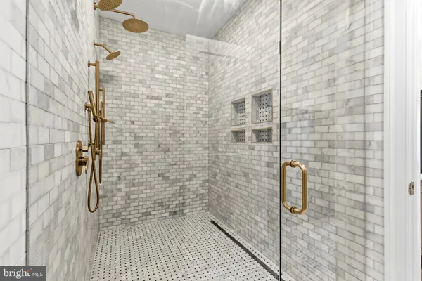 a backyard of a house with barbeque oven table and chairs