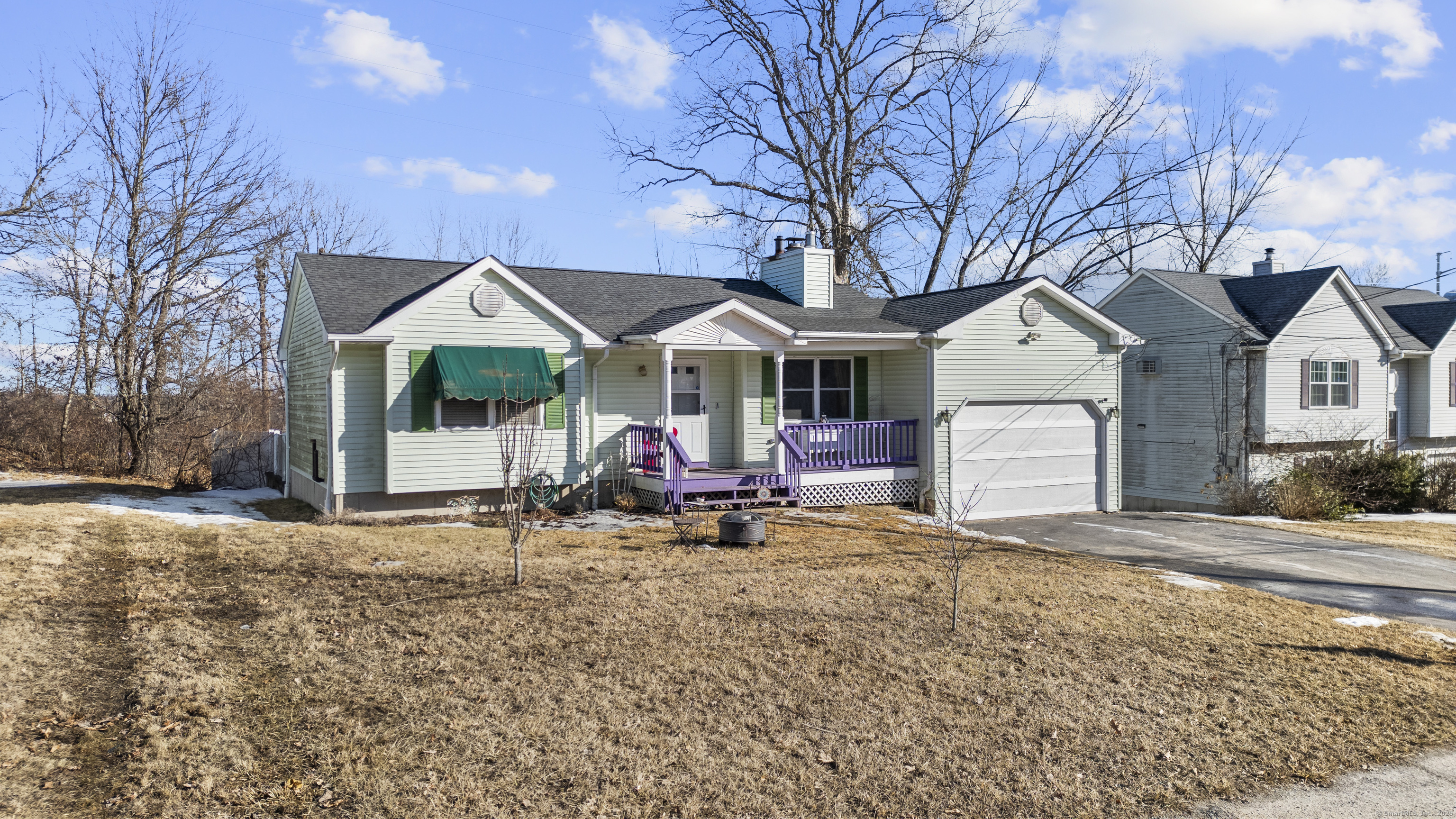 a view of a house with backyard porch and sitting area