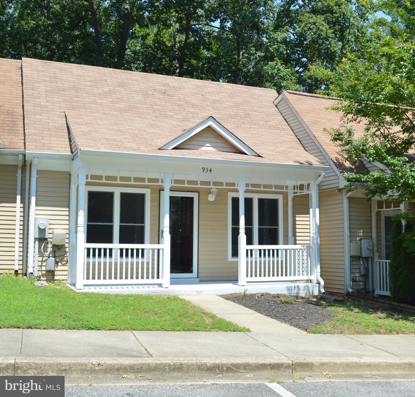 934 Riversedge Circle Annapolis, MD 21401 - Photo 1 of 25 a front view of a house with a garden