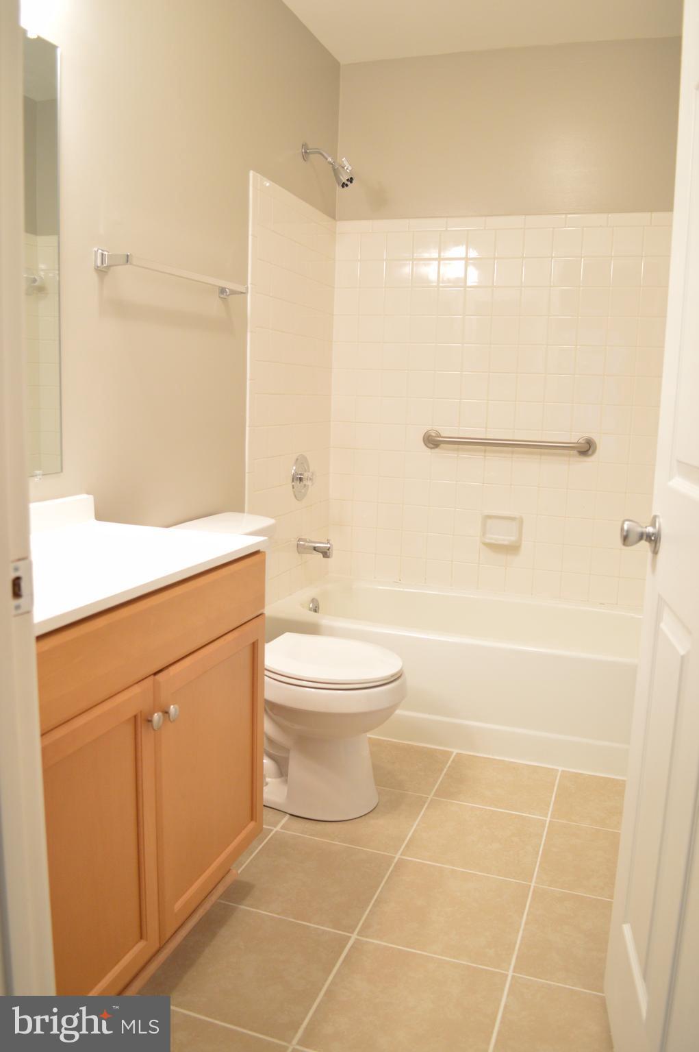 934 Riversedge Circle Annapolis, MD 21401 - Photo 13 of 25 a bathroom with a toilet a sink and shower