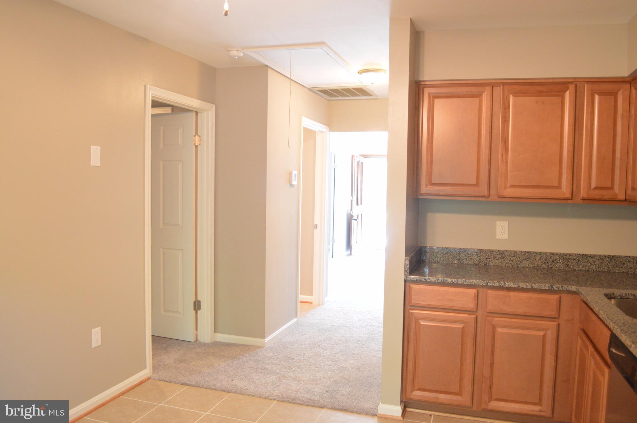 934 Riversedge Circle Annapolis, MD 21401 - Photo 14 of 25 a bathroom with a granite countertop sink and a mirror