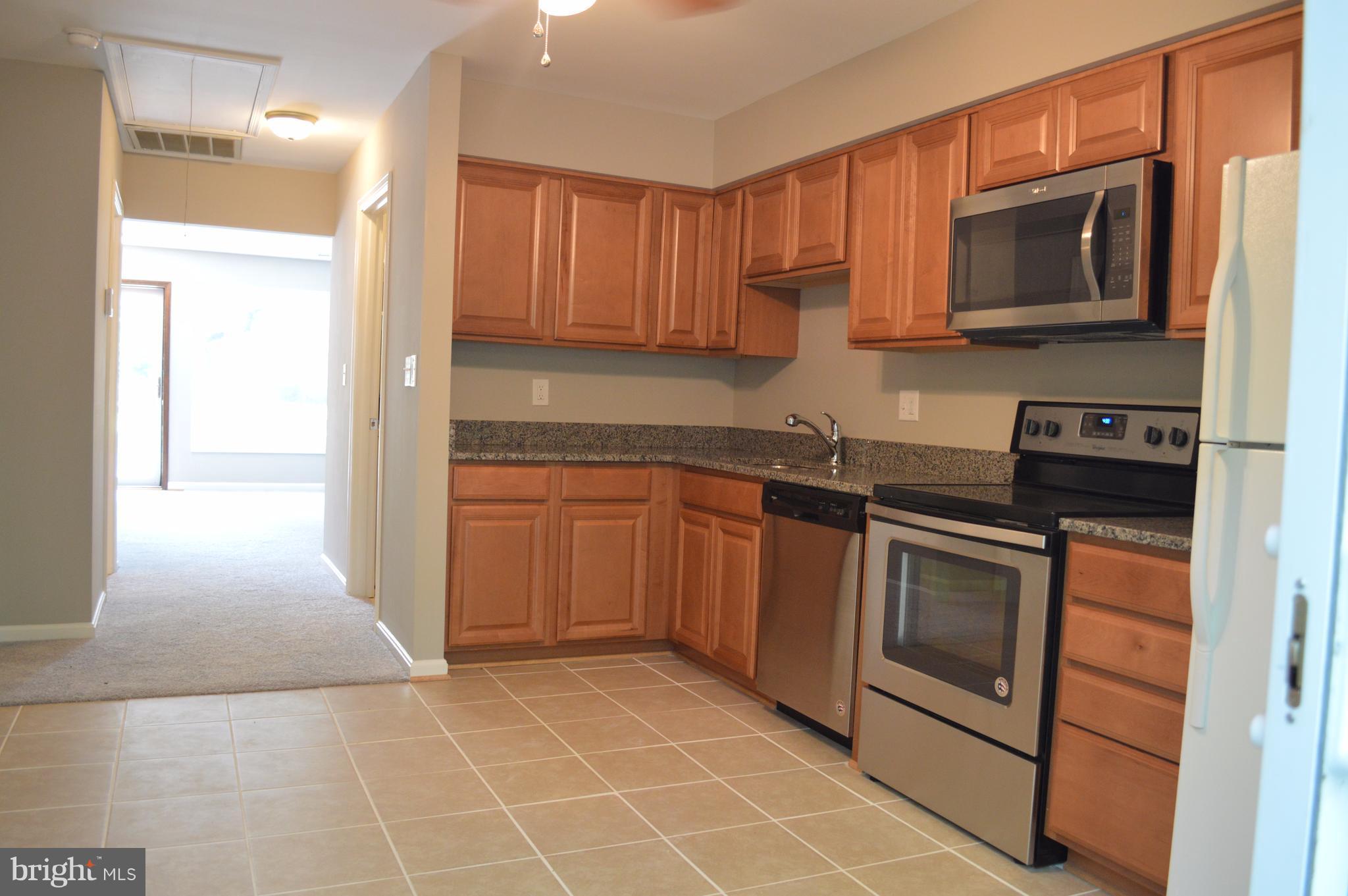 934 Riversedge Circle Annapolis, MD 21401 - Photo 15 of 25 a kitchen with a sink stove and microwave