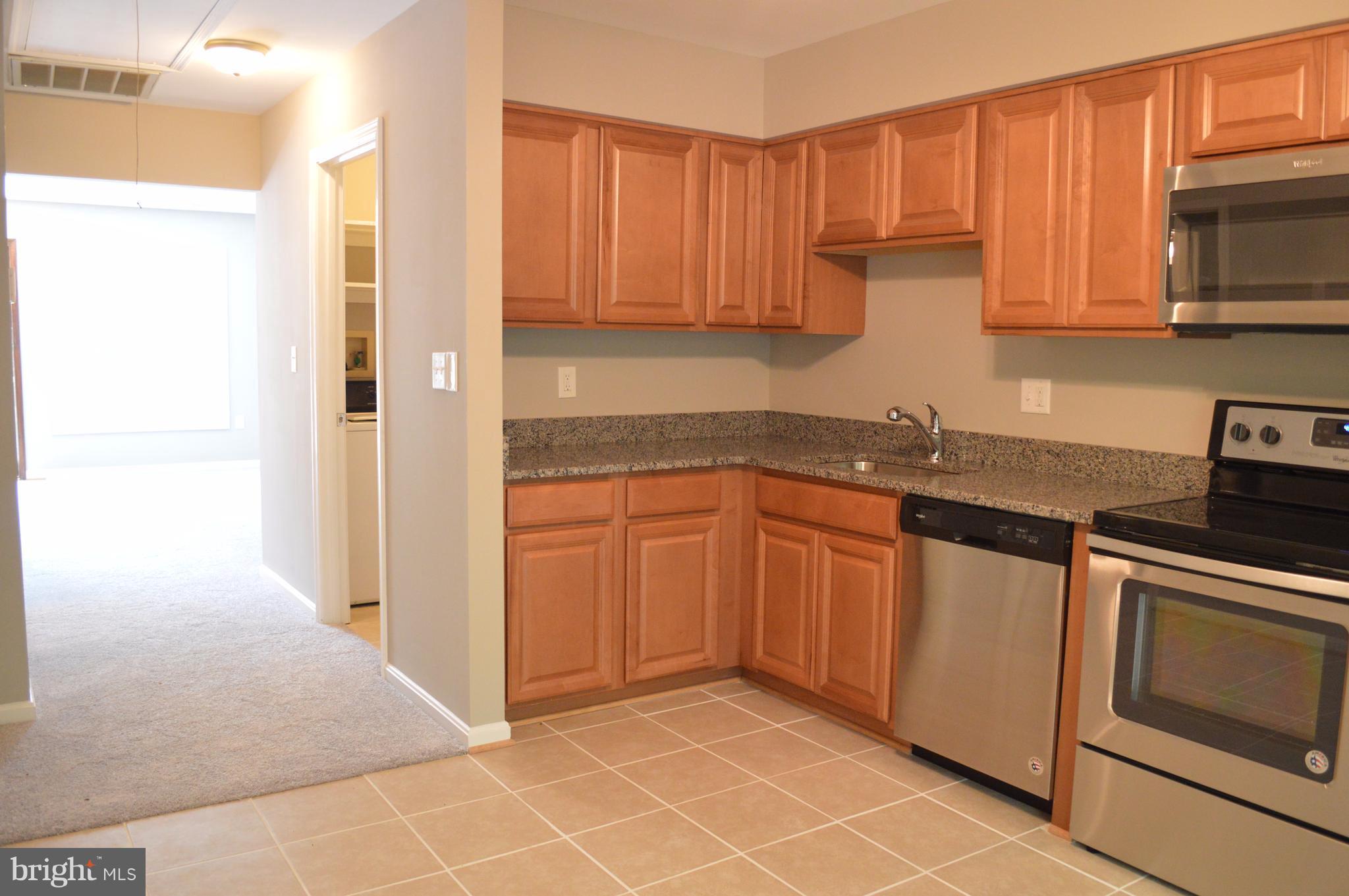 934 Riversedge Circle Annapolis, MD 21401 - Photo 17 of 25 a kitchen with stainless steel appliances granite countertop a refrigerator and a sink