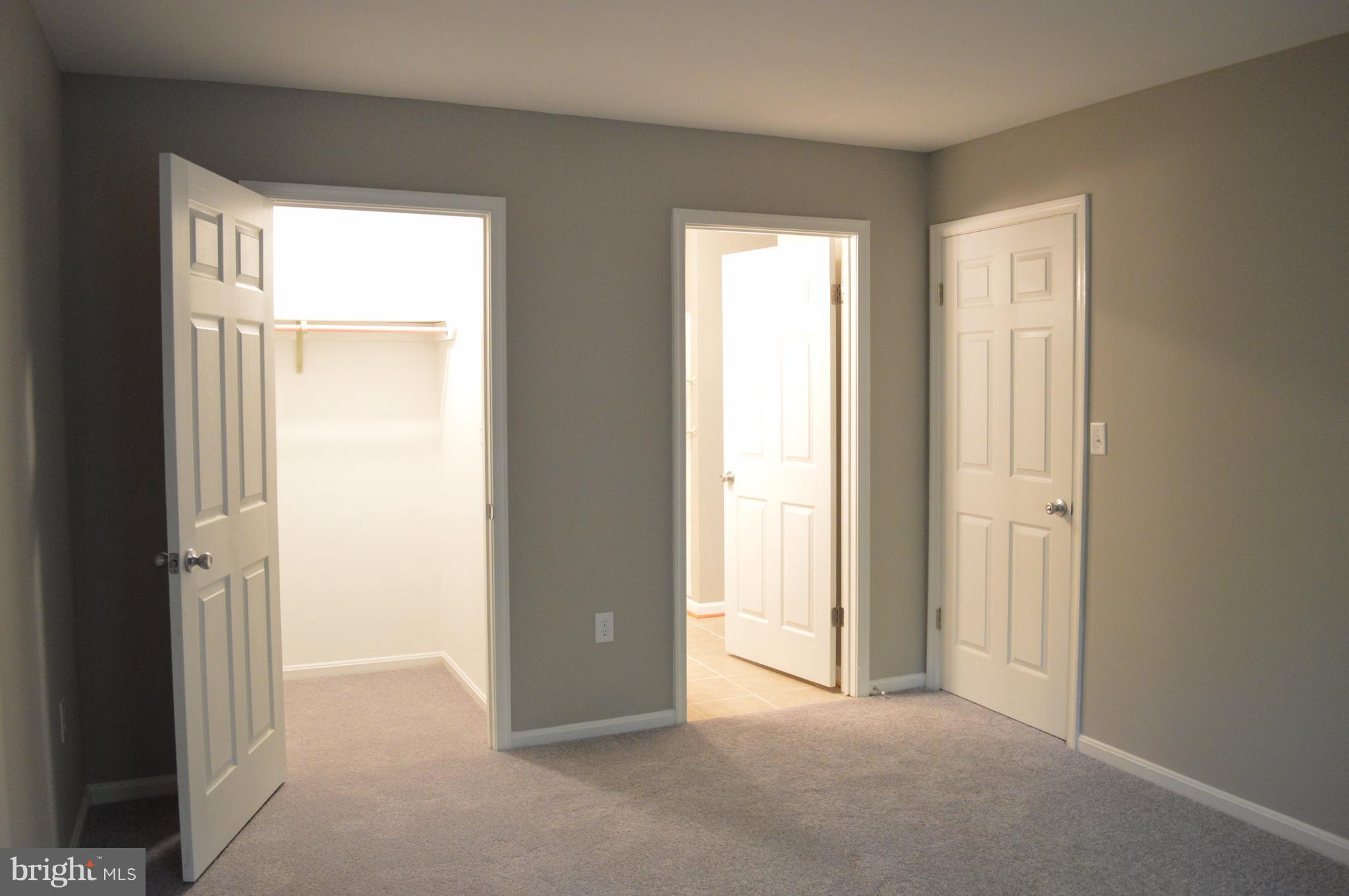 934 Riversedge Circle Annapolis, MD 21401 - Photo 22 of 25 an empty room with windows and closet