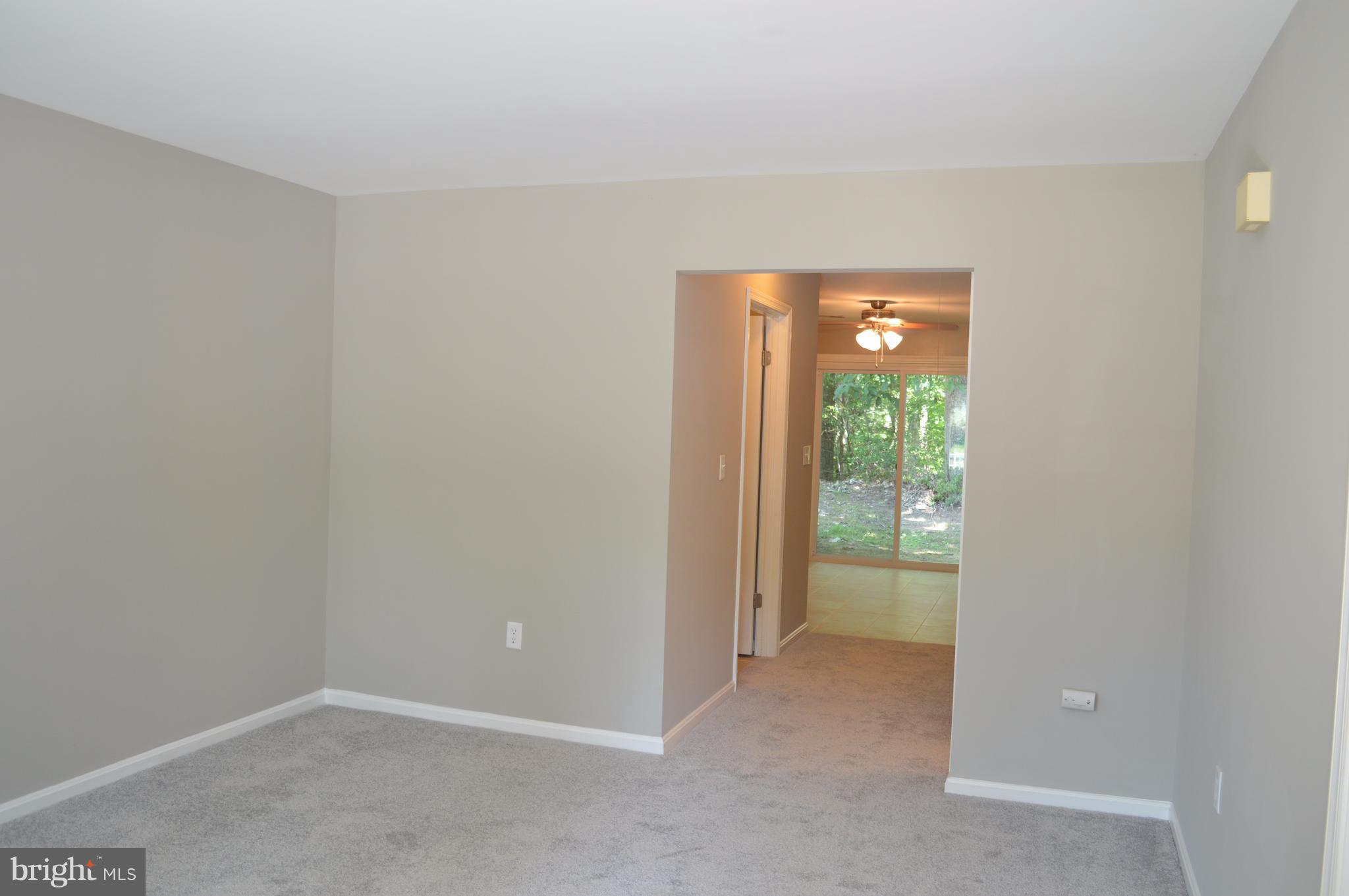 934 Riversedge Circle Annapolis, MD 21401 - Photo 5 of 25 a view of an empty room with a window