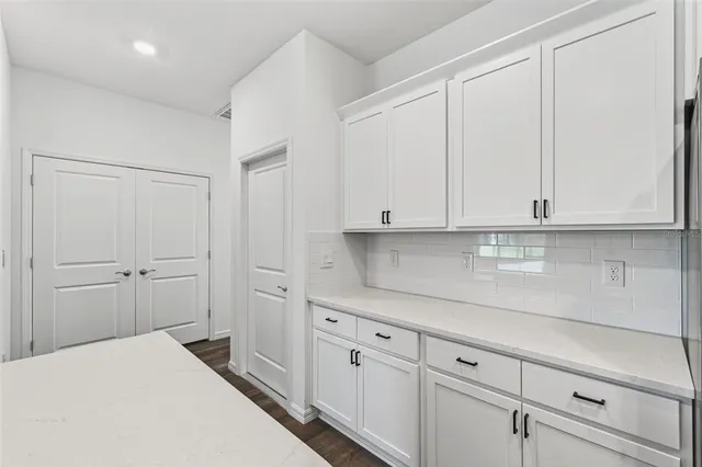 a view of kitchen with wooden floor