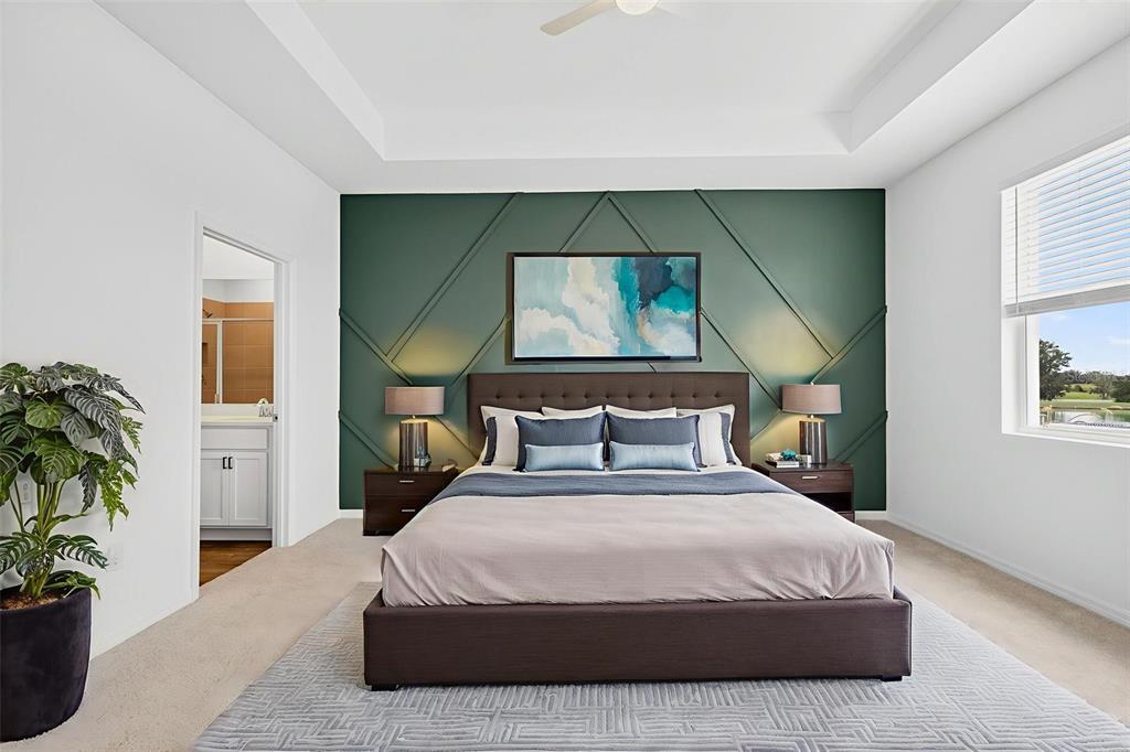 31463 Paper Birch Street Wesley Chapel, FL 33545 - Photo 24 of 40 a bedroom with a bed and a painting on the wall