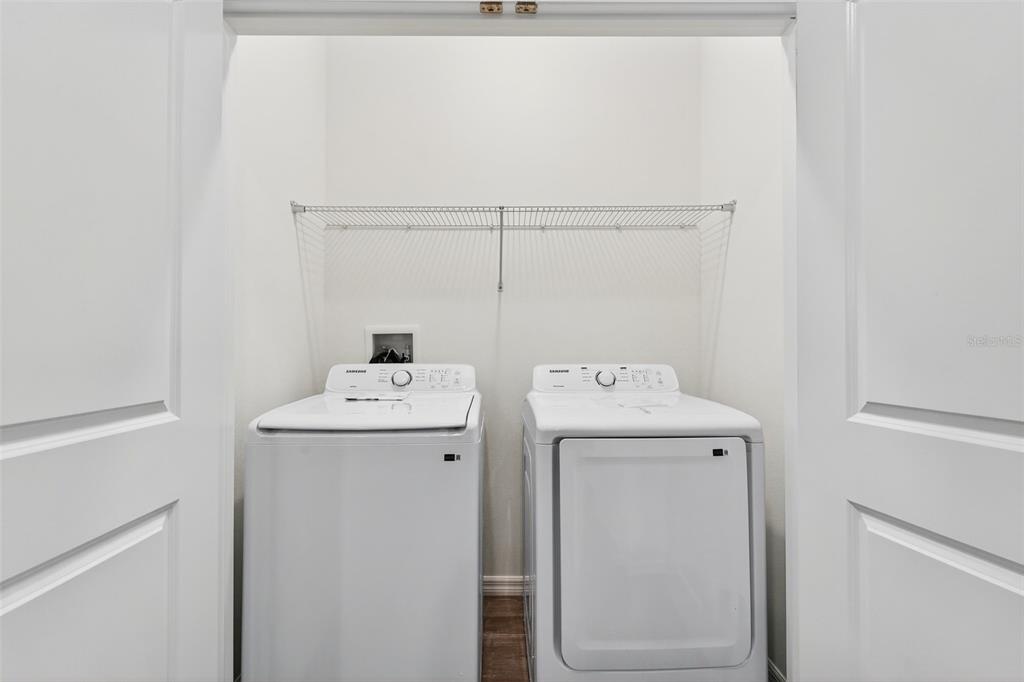 31463 Paper Birch Street Wesley Chapel, FL 33545 - Photo 30 of 40 a utility room with dryer and washer