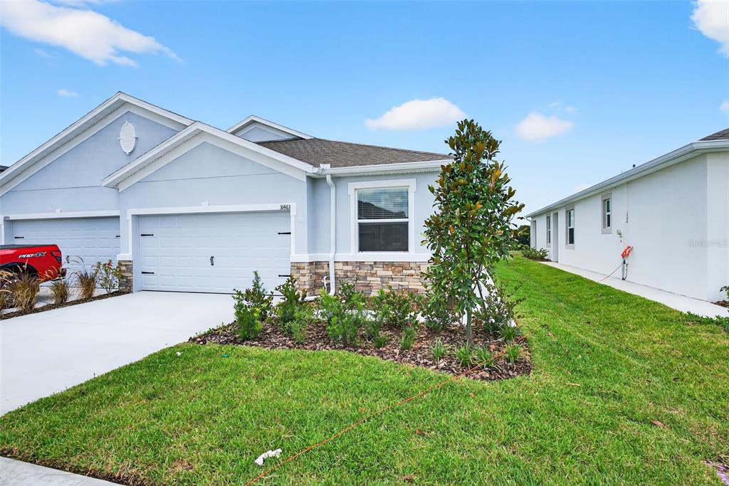 31463 Paper Birch Street Wesley Chapel, FL 33545 - Photo 3 of 40 a view of a garage