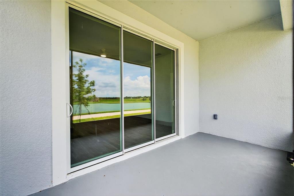 31463 Paper Birch Street Wesley Chapel, FL 33545 - Photo 36 of 40 a view of empty room with sliding glass door