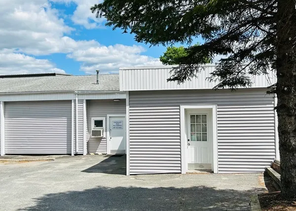 a view of a house with a tree