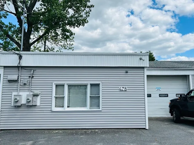 a view of a car in back of house