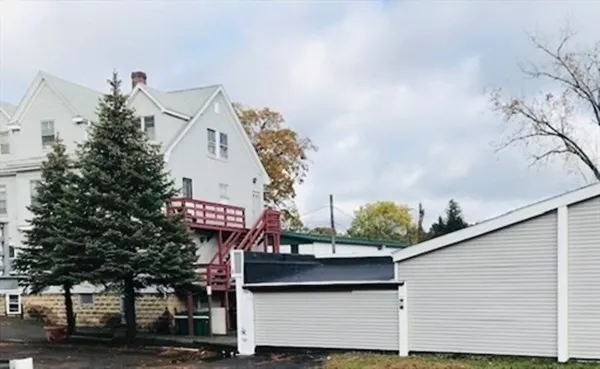 a view of a building with a tree in the background