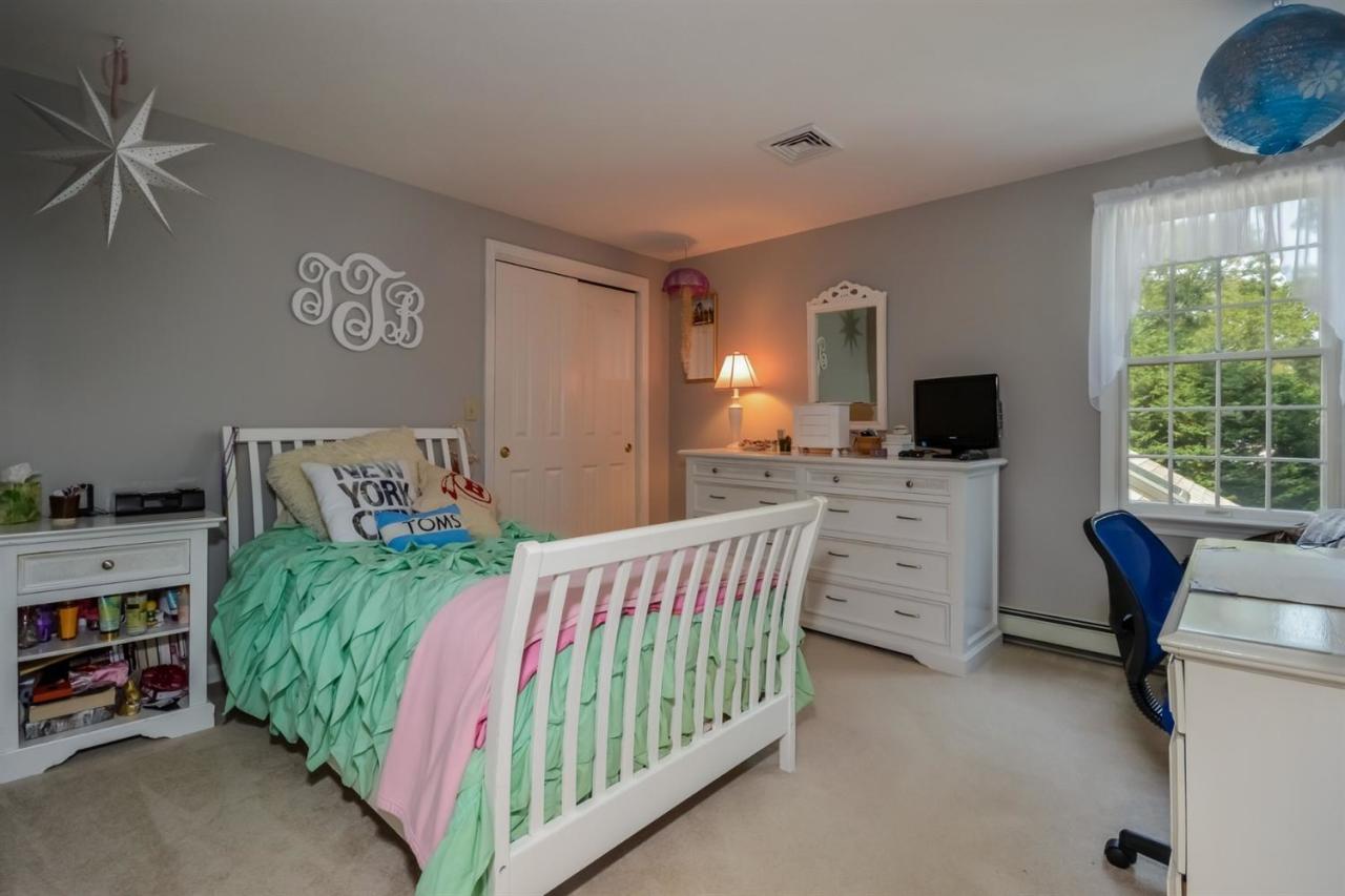164 Scudder Road Osterville, MA 02655 - Photo 14 of 30 a bedroom with furniture and a flat screen tv