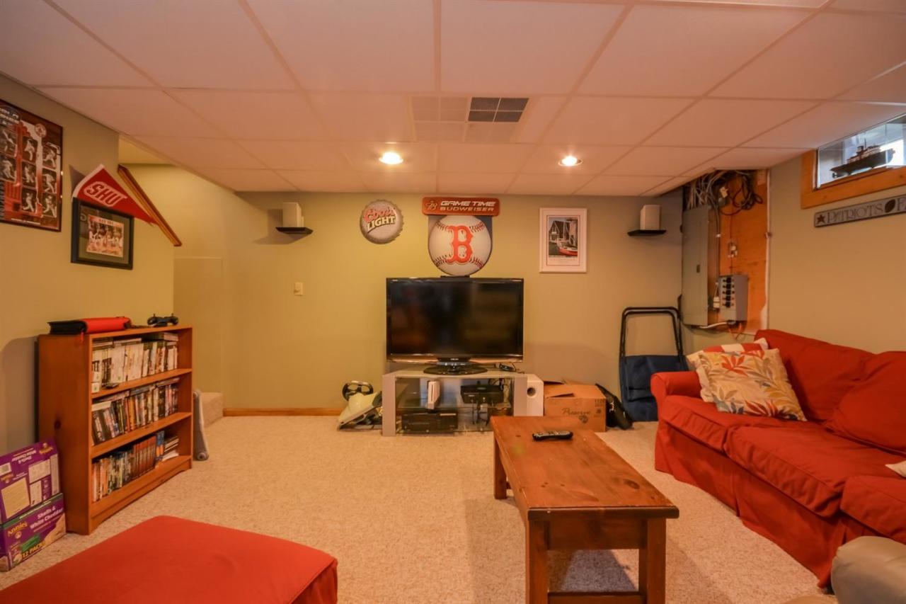 164 Scudder Road Osterville, MA 02655 - Photo 17 of 30 a living room with furniture and a flat screen tv