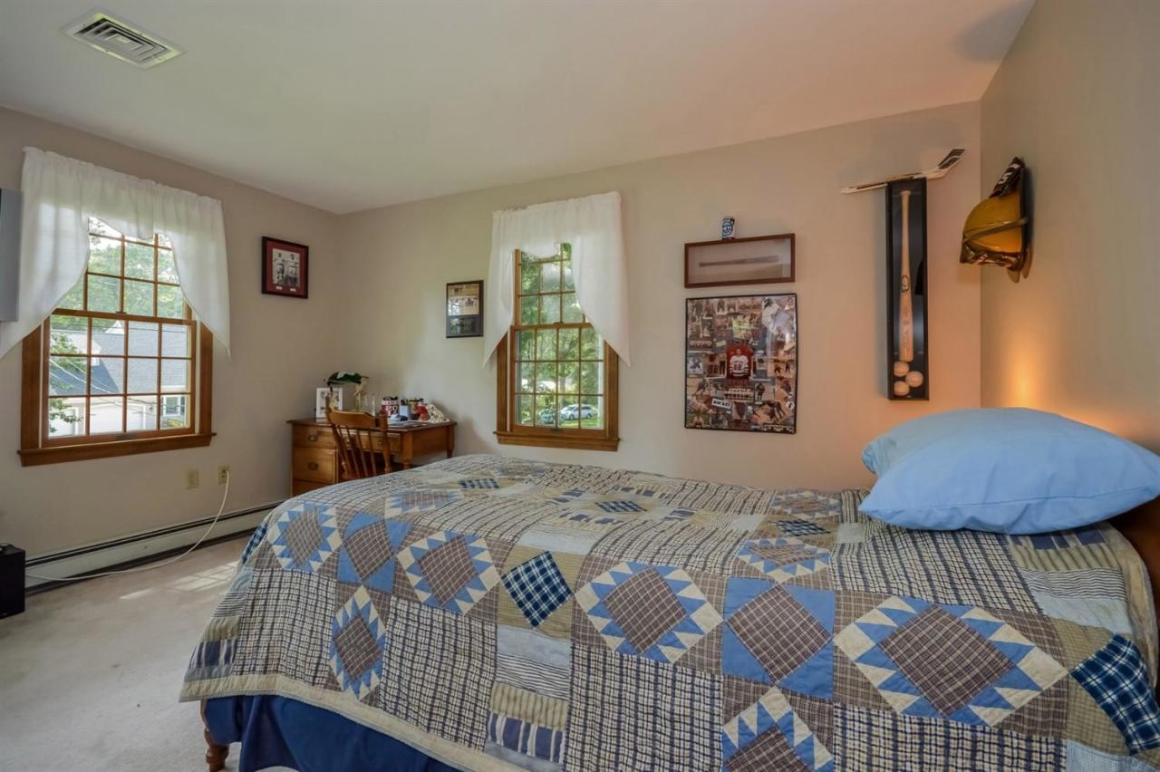 164 Scudder Road Osterville, MA 02655 - Photo 19 of 30 a bedroom with a bed a dresser and next to a window
