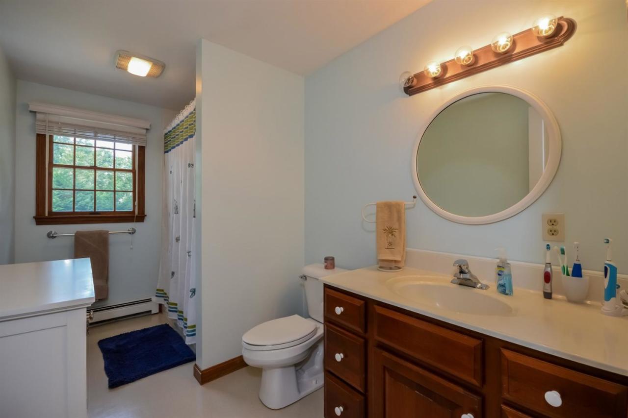 164 Scudder Road Osterville, MA 02655 - Photo 20 of 30 a bathroom with a toilet a sink and mirror