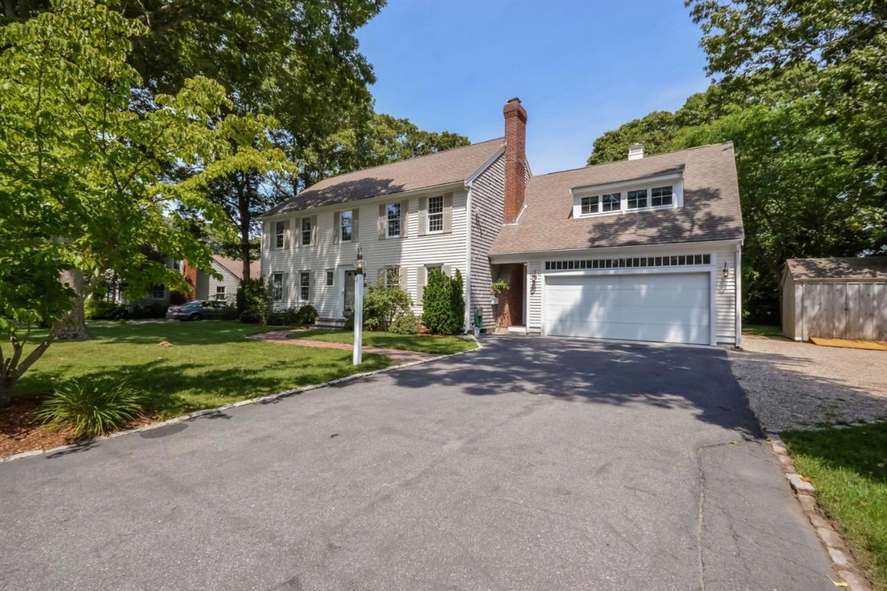 164 Scudder Road Osterville, MA 02655 - Photo 2 of 30 a view of a house with a yard and garage