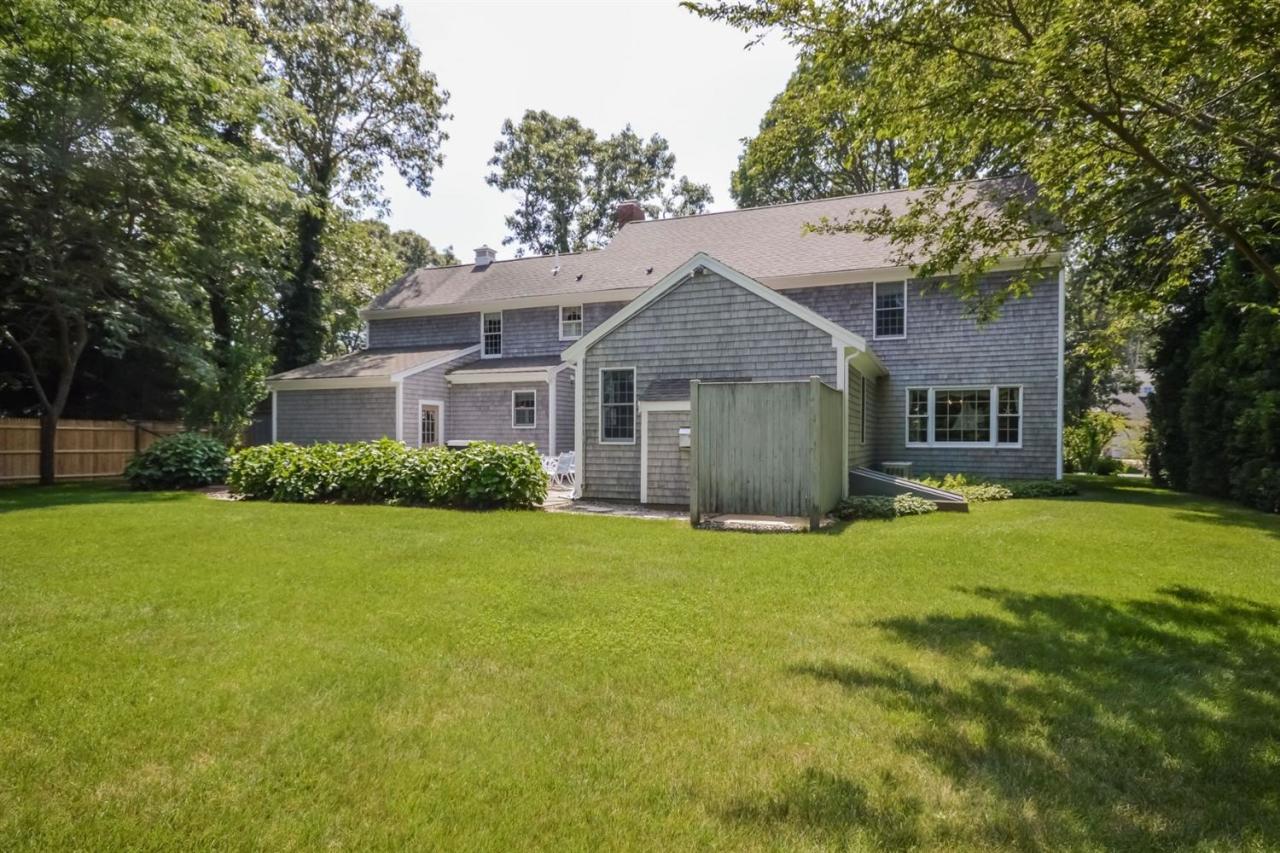 164 Scudder Road Osterville, MA 02655 - Photo 25 of 30 a front view of a house with a garden