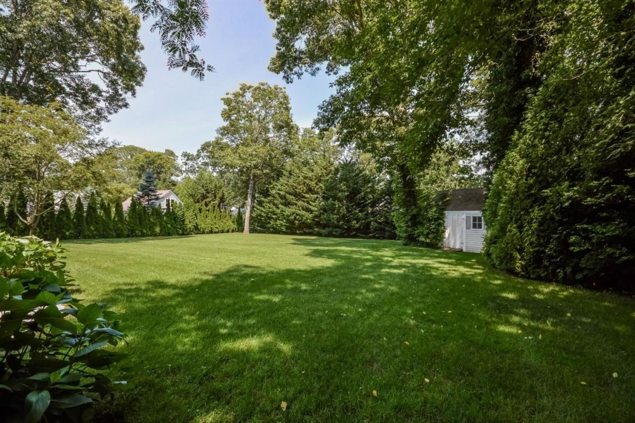 164 Scudder Road Osterville, MA 02655 - Photo 26 of 30 a view of a field with a tree