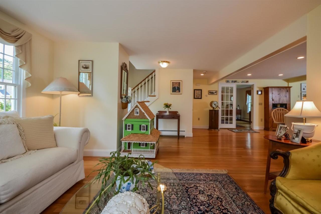 164 Scudder Road Osterville, MA 02655 - Photo 3 of 30 a living room with furniture a table and a potted plant