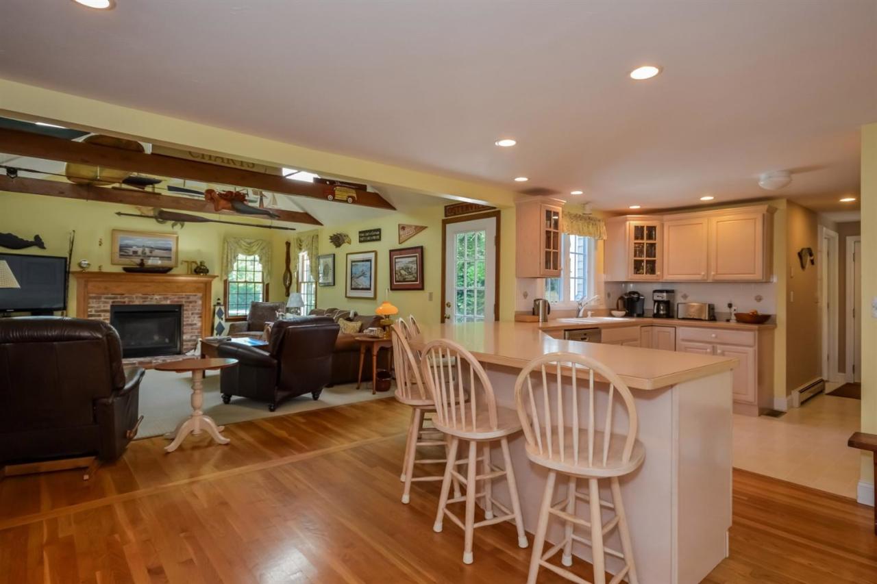164 Scudder Road Osterville, MA 02655 - Photo 9 of 30 a view of a dining room with furniture window and wooden floor