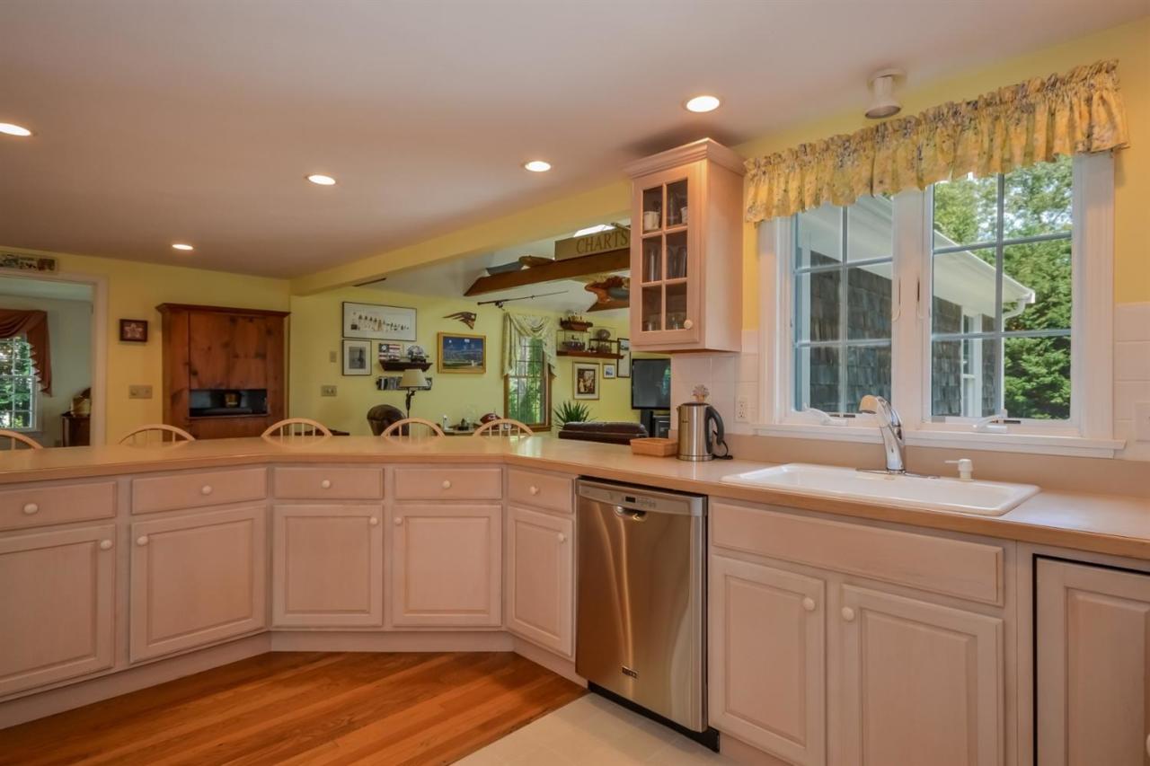 164 Scudder Road Osterville, MA 02655 - Photo 10 of 30 a kitchen with a sink windows and cabinets