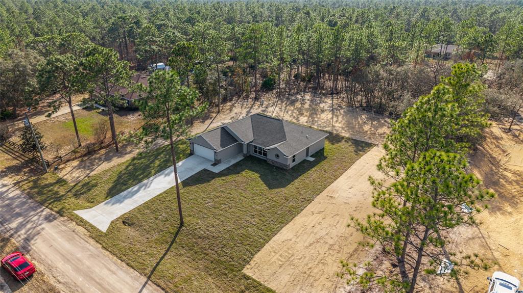 5796 Southwest 124th Ter Road Ocala, FL 34481 - Photo 50 of 63 a view of a yard with chairs