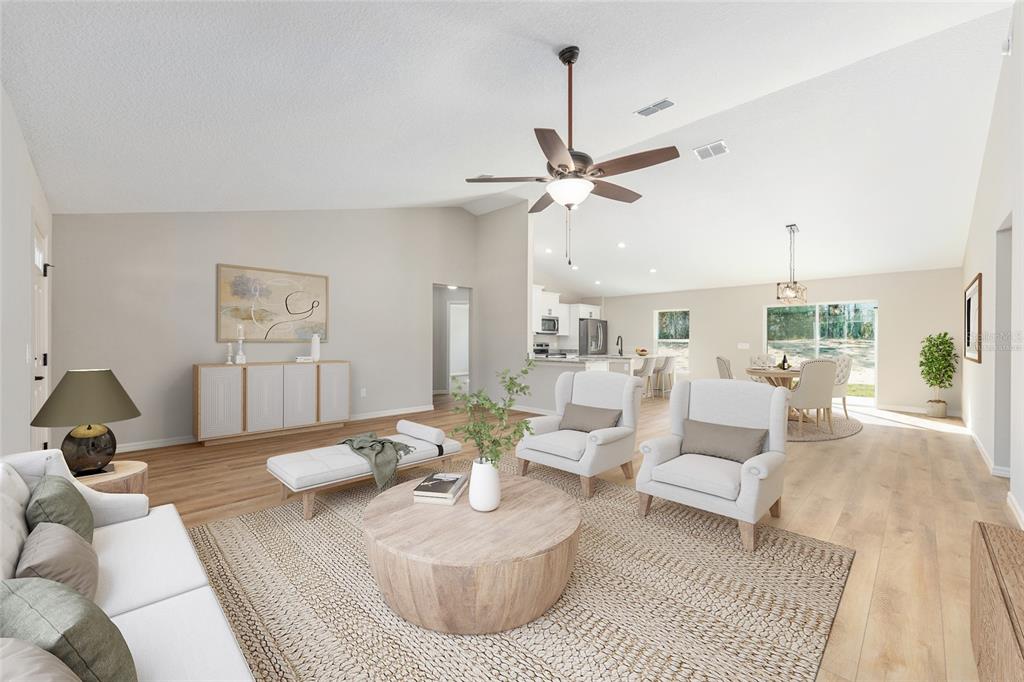 5796 Southwest 124th Ter Road Ocala, FL 34481 - Photo 10 of 63 a living room with furniture and a chandelier