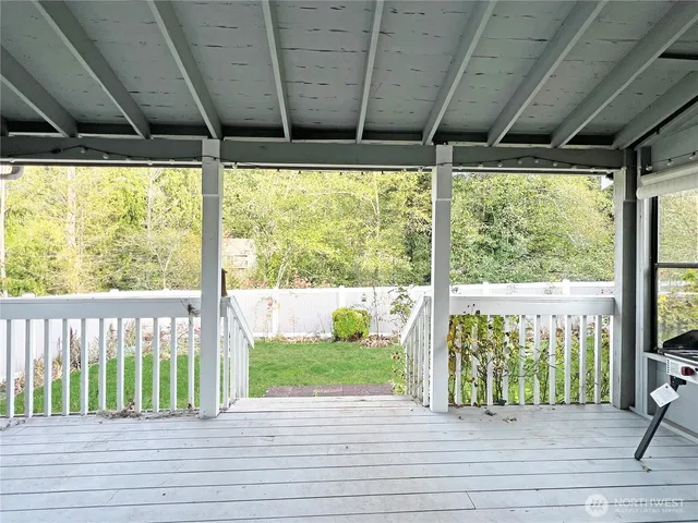 a view of a porch with wooden floor and outdoor space