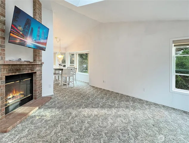 a view of a livingroom with furniture and a fireplace
