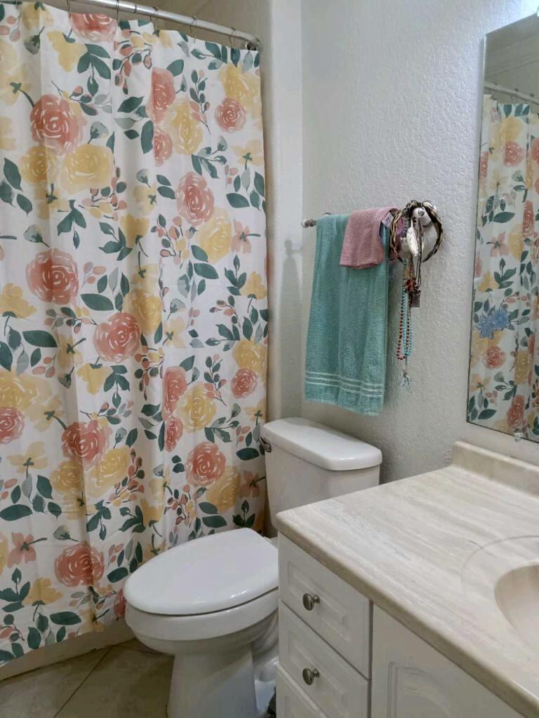 4208 Southeast 27th Street Okeechobee, FL 34974 - Photo 20 of 21 a bathroom with a sink toilet and shower