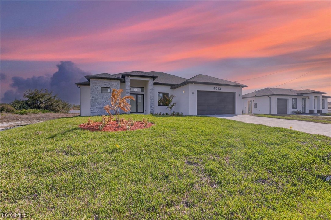 4013 12th Street Southwest Lehigh Acres, FL 33976 - Photo 1 of 29 a view of a house with a big yard and a large tree