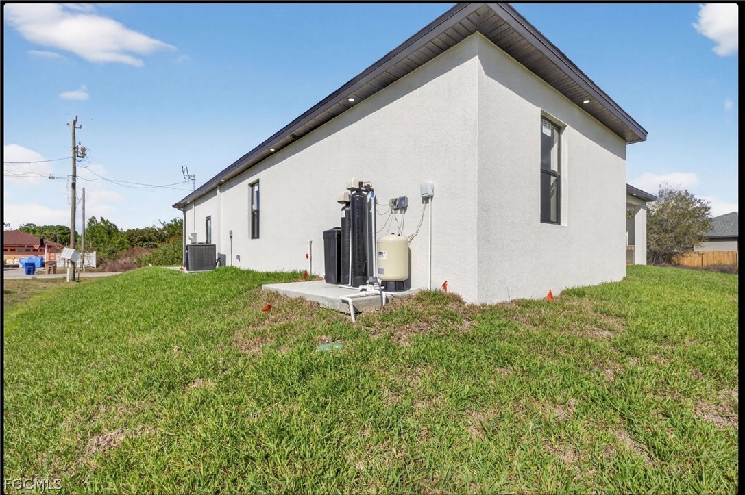 4013 12th Street Southwest Lehigh Acres, FL 33976 - Photo 23 of 29 a view of a house with backyard