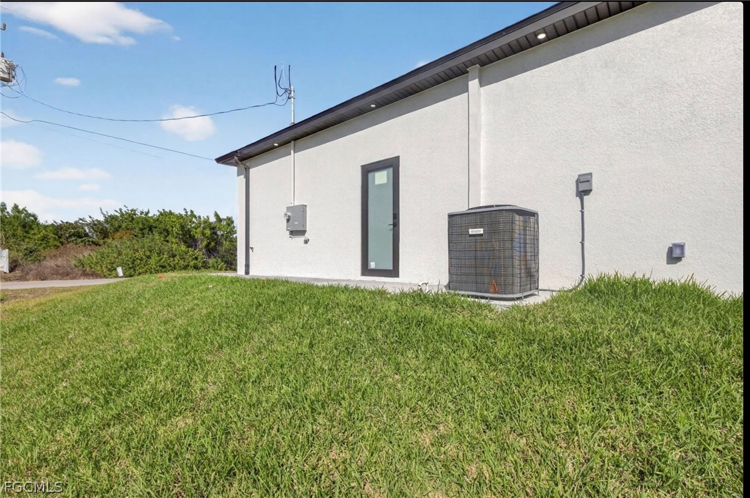 4013 12th Street Southwest Lehigh Acres, FL 33976 - Photo 24 of 29 a view of a house with backyard and garden