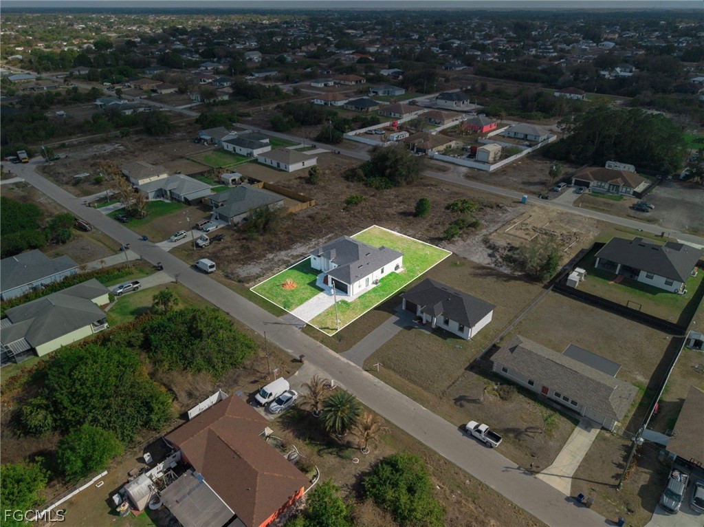4013 12th Street Southwest Lehigh Acres, FL 33976 - Photo 28 of 29 an aerial view of residential houses with outdoor space