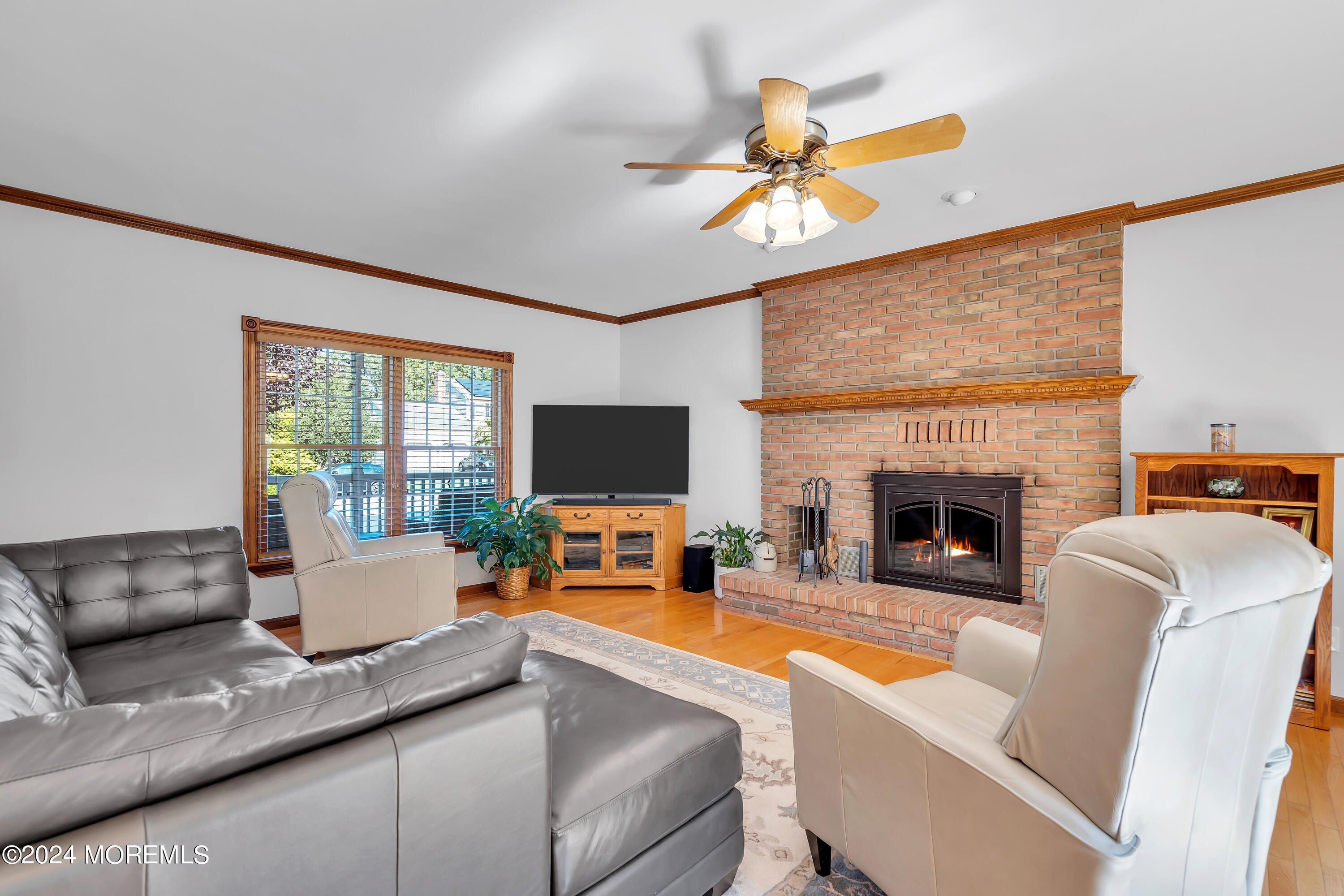 519 Admirals Circle Pine Beach, NJ 08741 - Photo 14 of 72 a living room with furniture a fireplace and a flat screen tv