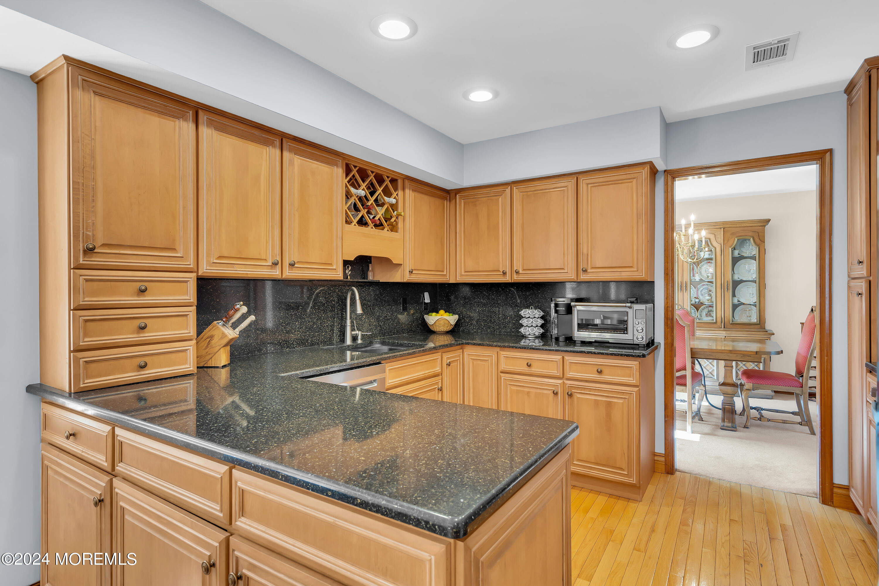 519 Admirals Circle Pine Beach, NJ 08741 - Photo 21 of 72 a kitchen with stainless steel appliances granite countertop a sink a stove and cabinets
