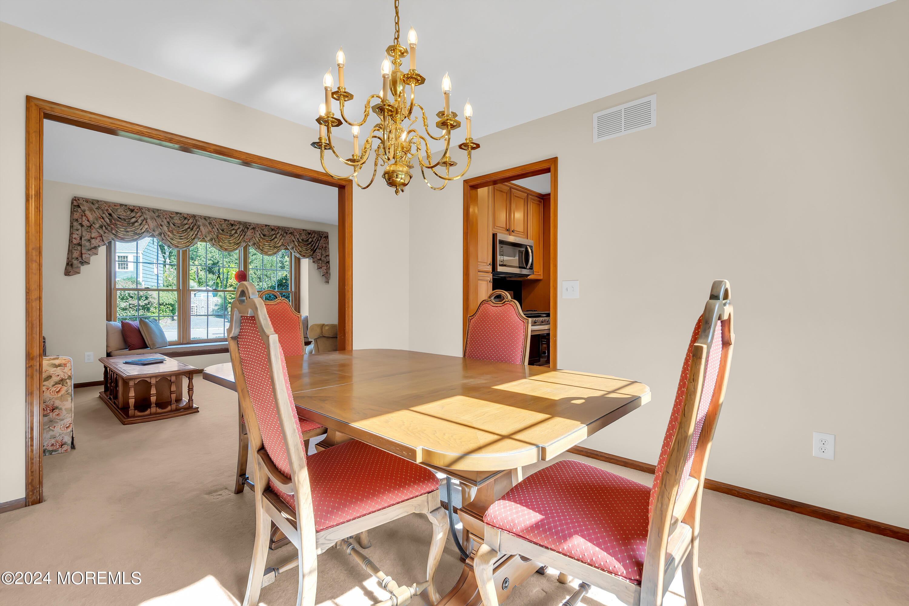 519 Admirals Circle Pine Beach, NJ 08741 - Photo 26 of 72 a view of a dining room with furniture a chandelier and wooden floor