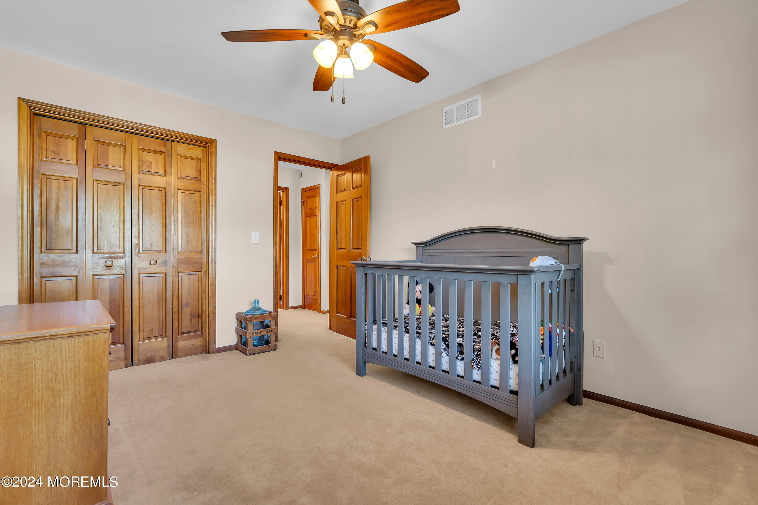 519 Admirals Circle Pine Beach, NJ 08741 - Photo 47 of 72 a view of a bedroom with windows and a chandelier fan