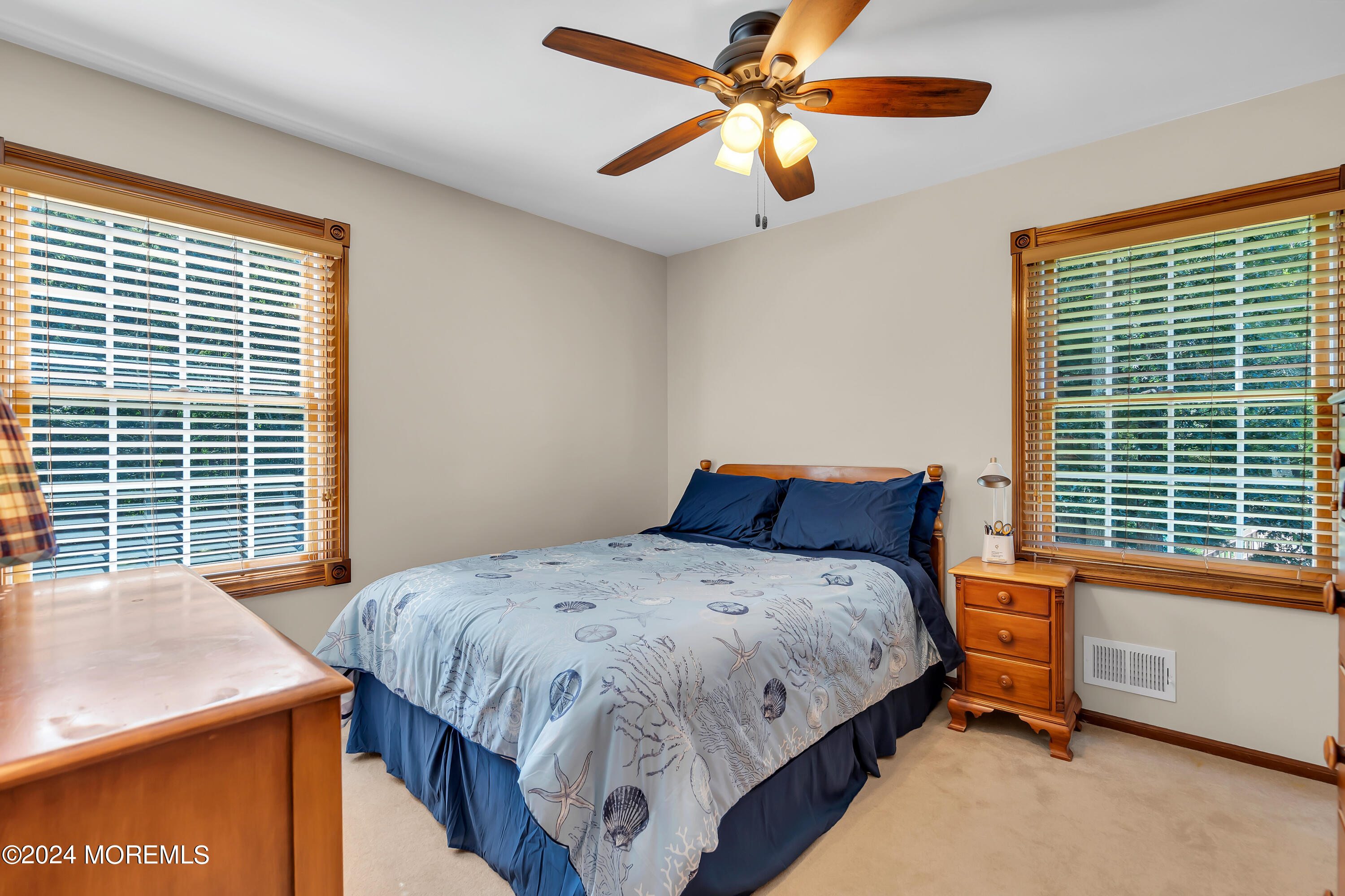 519 Admirals Circle Pine Beach, NJ 08741 - Photo 53 of 72 a bedroom with a bed and a chandelier