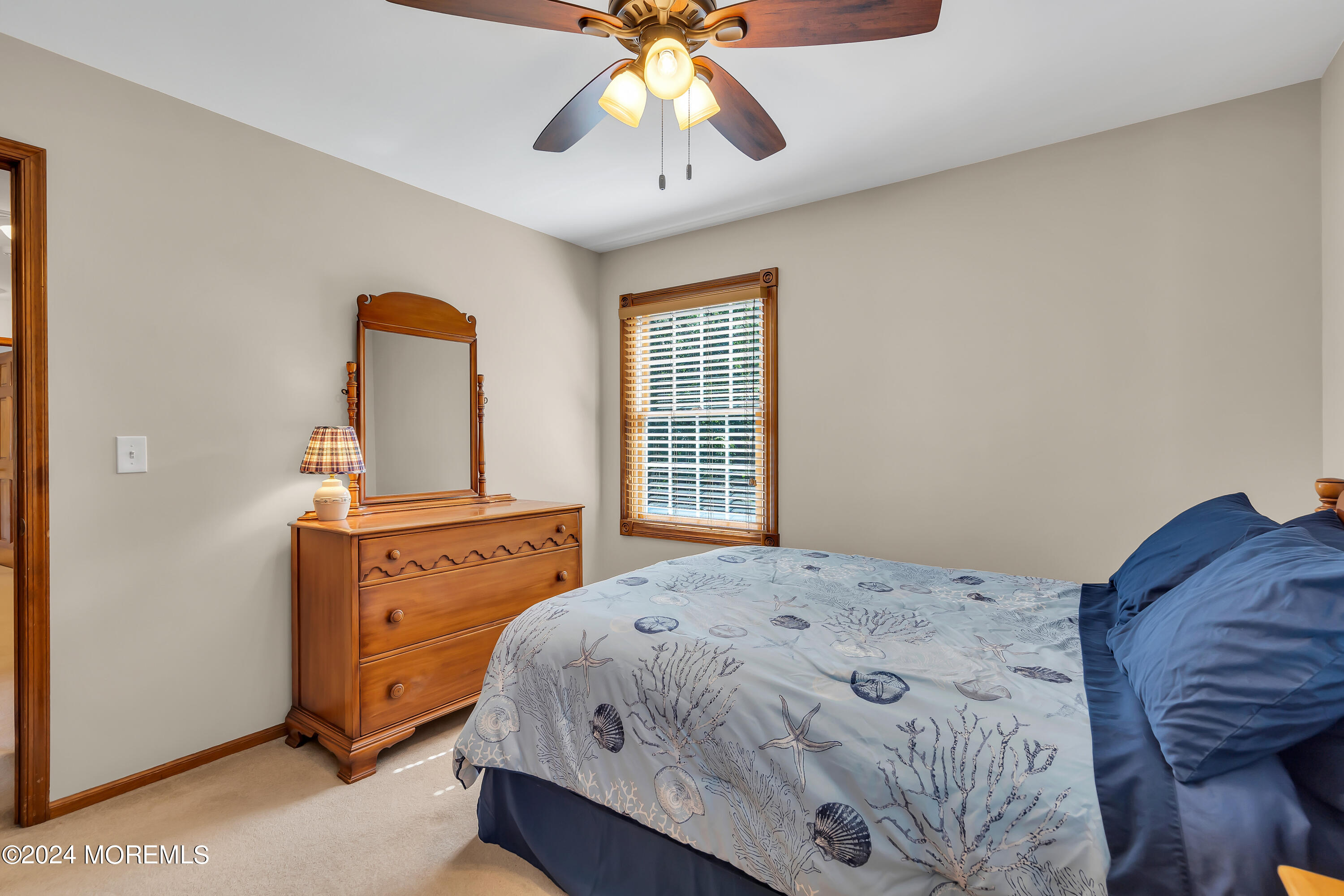 519 Admirals Circle Pine Beach, NJ 08741 - Photo 54 of 72 a bedroom with a bed and a chandelier