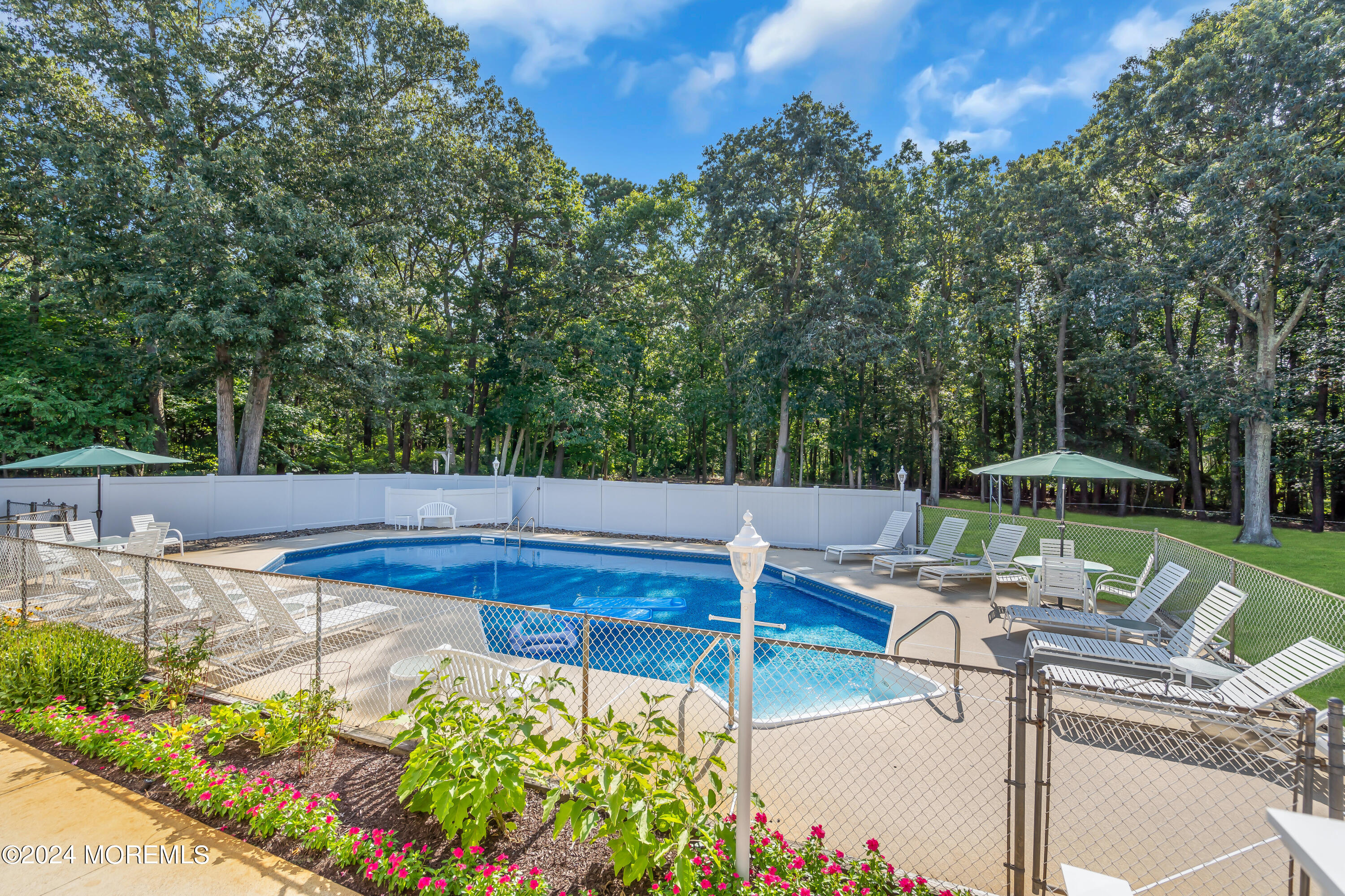 519 Admirals Circle Pine Beach, NJ 08741 - Photo 60 of 72 a view of a backyard with sitting area