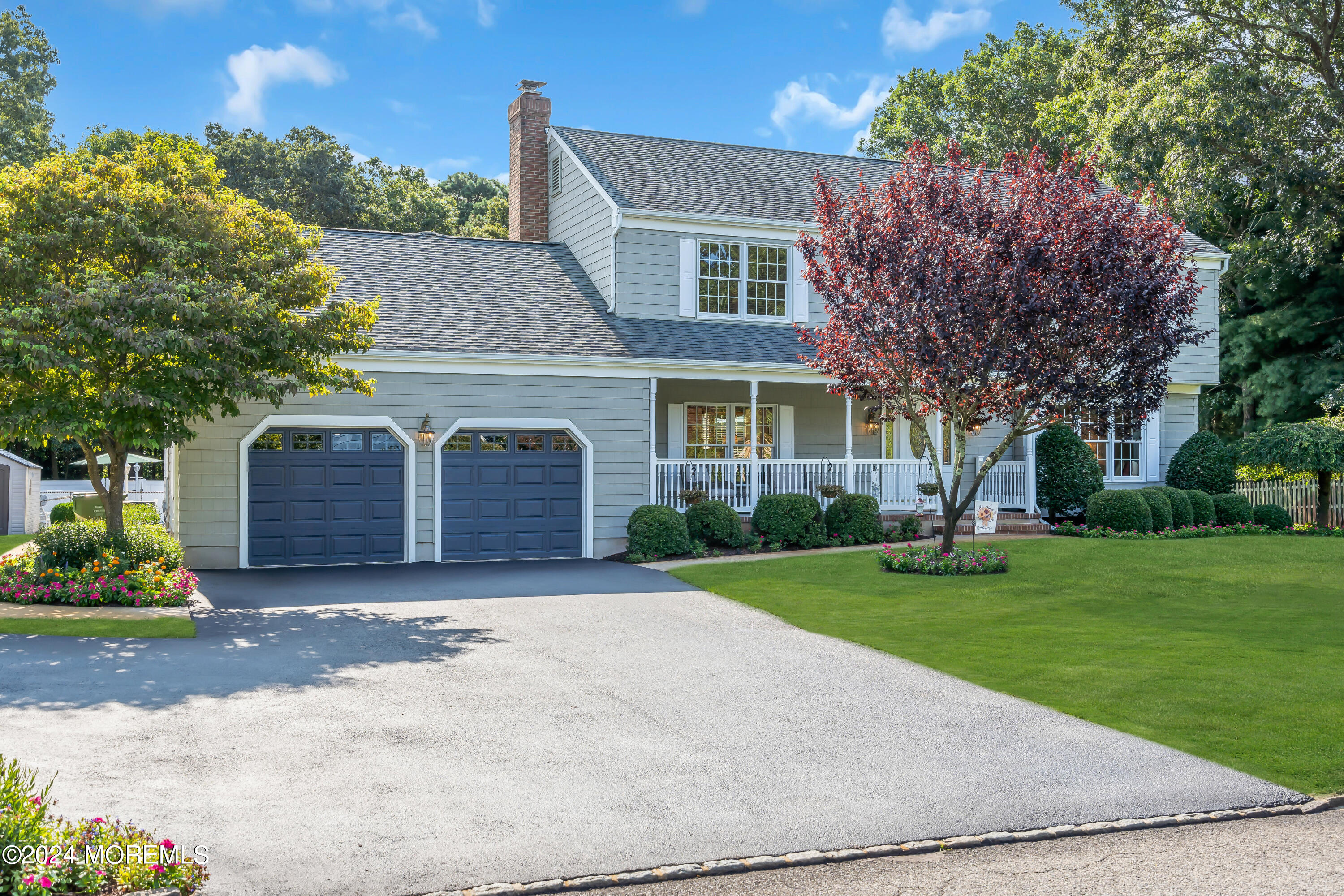 519 Admirals Circle Pine Beach, NJ 08741 - Photo 6 of 72 a front view of a house with a yard and garage