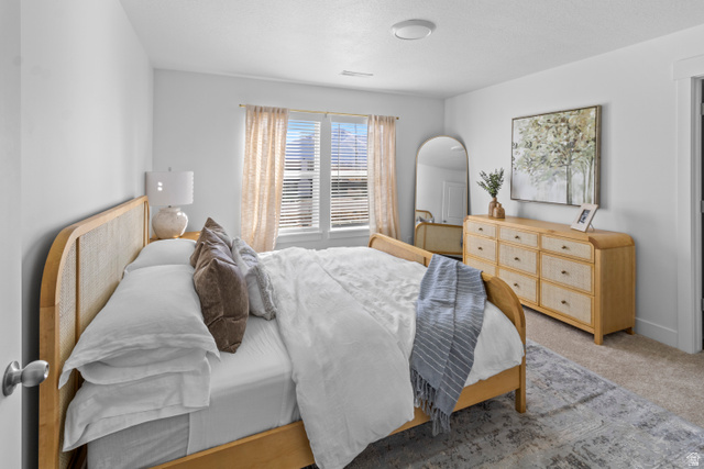 1264 West 500 South, Unit 320 Logan, UT 84321 - Photo 14 of 39 Neutral-toned bedroom featuring white walls and carpeted flooring