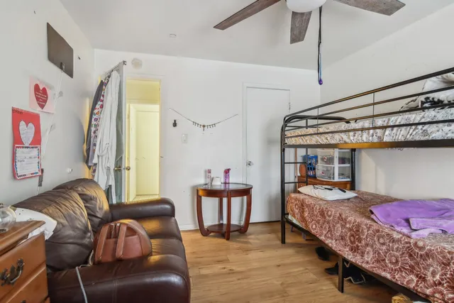 a bedroom with furniture and a bed